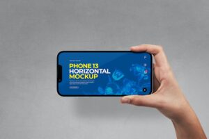 Banner image of Premium Hand Holding Phone 13 - Horizontal  Free Download
