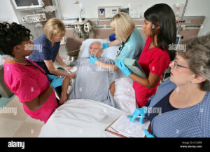 A rapid response team of nurses works on a patient in a hospital Stock