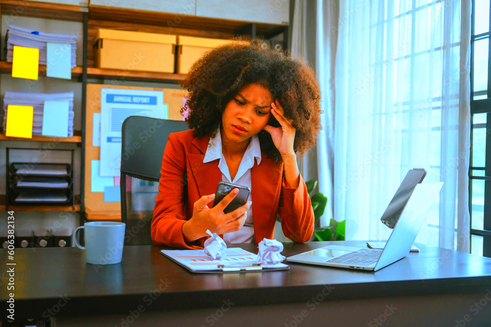 Tired african american business woman working with audit balance sheet